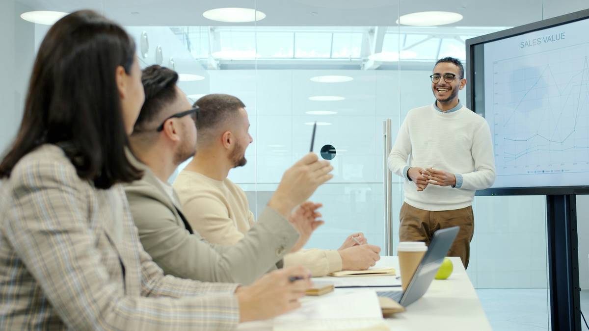 A diverse group of professionals reviewing interview feedback notes, labeled 'interview coaching career transition job coache'